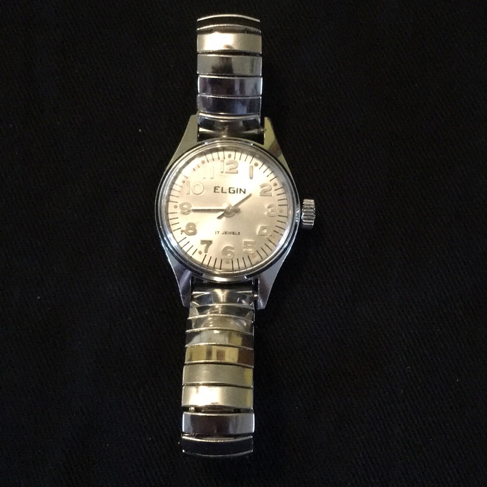 Small silver retractable band watch